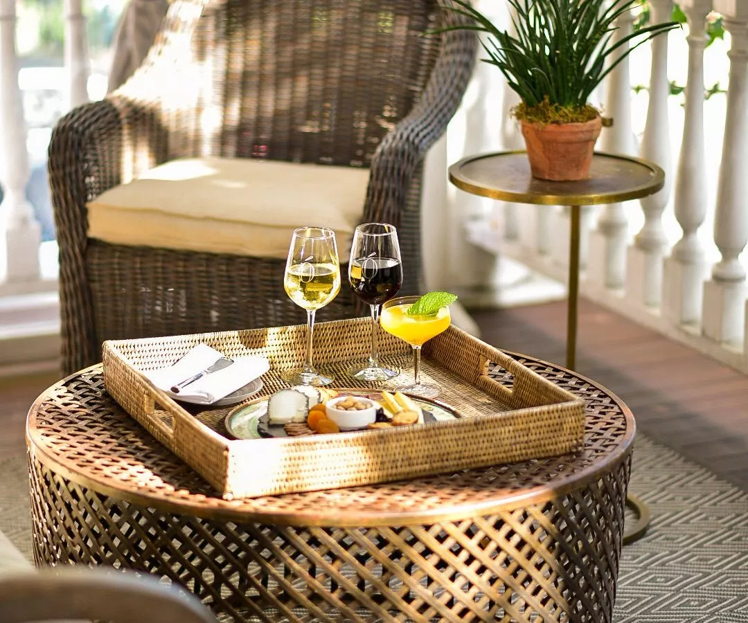 Breakfast tray on outside veranda with wicker table and chair